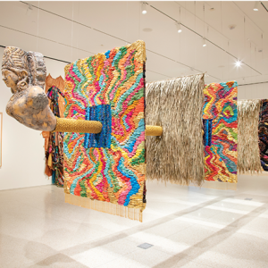 Cover image Journal of Indentureship and Its Legacies, (Volume 6, Issue 1). Modern art with tapestry blocks and a ship's figurehead emerging from them.